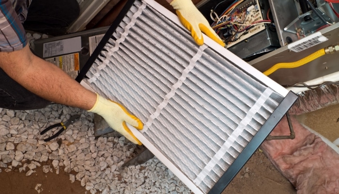 Technician Changing Filter Technician Changing Filter