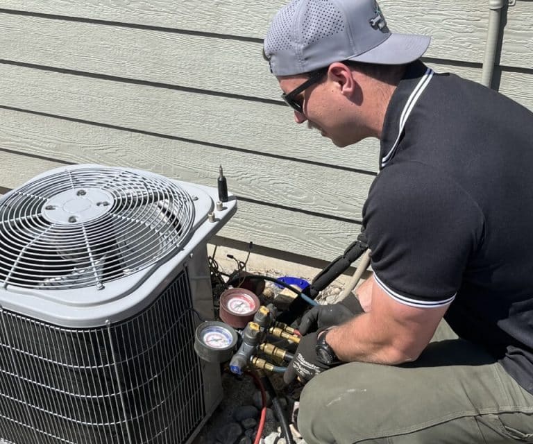 Technician Performing Hvac Maintenance