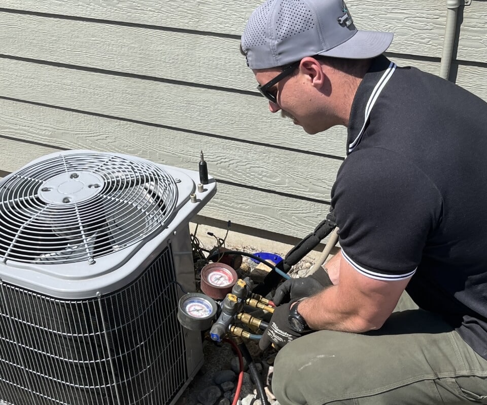 technician-performing-hvac-maintenance